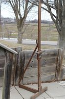 Full view of wooden easel standing outdoors