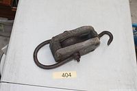 Top view of wooden block and tackle showing wood body, iron ring and hook
