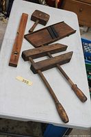 All four wooden tools laid out on table