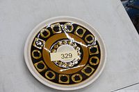 Top view of decorative ceramic bowl showing pattern and size tag 329