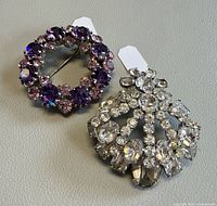 Both brooches front view showing color and design