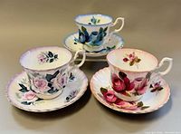 All three Royal Albert teacup and saucer sets displayed