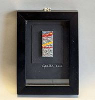 Front view of framed matchbox art signed Grella 2000