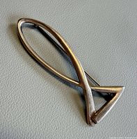 Front view of silver fish pendant