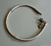 Full bracelet laid flat showing overall design and length