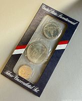 Front of sealed 3-coin uncirculated bicentennial set in original navy sleeve