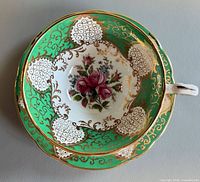 Top view showing interior decoration of teacup nested in saucer