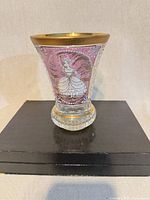 Front showing figural scene on cranberry overlay and gold rim