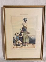 Framed color lithograph with mat, showing artwork, mat, and gilt frame