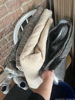 Stack of three folded moving blankets
