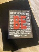 Front view of black motivational text canvas