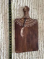 Front of charcuterie board beside tape measure