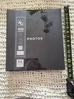 Front cover showing KG logo, capacity and tape measure for scale