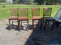 All four barstools side by side outdoors