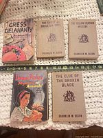 Front covers laid out showing all five book titles