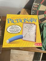 Front of Pictionary box showing title and stick-figure graphic