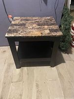 Full view of square side table showing top and shelf