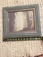 Front view of frame with tape measure showing approx 14 in width
