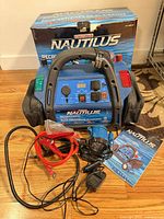 Power pack with accessories, charger, cables, work light, manual and box