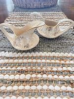 Top view of both creamers showing floral décor and gold trim