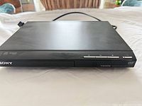 Front view of Sony DVP-SR510H DVD player showing overall condition and front controls