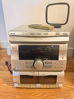 Front view of Sony HCD-RX33 with remote and antenna