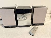 Front view of main unit with both speakers and remote