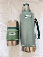 Front view of Stanley green vacuum bottle and food jar