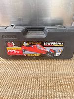 Closed carrying case showing brand label and specs