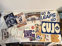 All items laid out: posters, programs, signs, cards