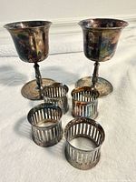 Group view: two goblets, four napkin rings