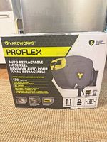 Front of retail box showing Yardworks PROFLEX hose reel and key specifications