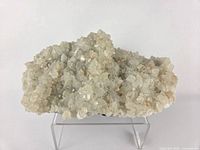 Full view of apophyllite/stilbite specimen on acrylic stand