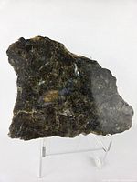 Front view of labradorite slab on stand