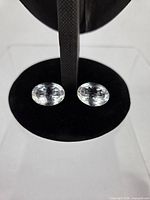 Pair of oval faceted clear quartz gemstones top view