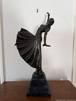 Full view of bronze Chorus Girl sculpture on marble base