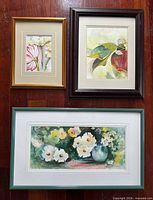 Group shot of three framed watercolour paintings