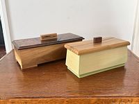 Both boxes side by side showing overall appearance and lids