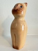 Front angled view of entire carved cat
