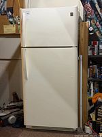 Full front view of off-white Kenmore top-freezer refrigerator