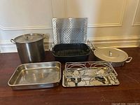 Group view of all cookware, warmer and trivet