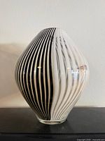 overall view of striped art glass vase showing pattern and form