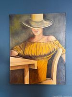 Full view of unframed oil painting on blue wall