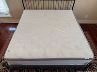 Full view of king mattress on bed frame