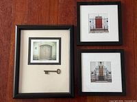 All three framed pieces grouped on hardwood floor