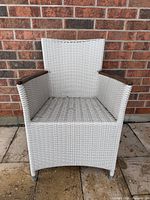 Front view of white wicker patio chair