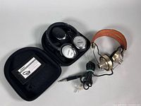 Both headphones, Bose case and Pioneer set visible