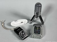 Group shot of all lot contents: Canon camera, docking cradle, Samson Meteor microphone, Zoom H2 recorder