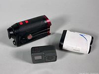 Group shot of GoPro camera, Nikon COOLSHOT 20 rangefinder, AOFAR 6x25 rangefinder