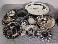 Group shot of all silver plated pieces in lot